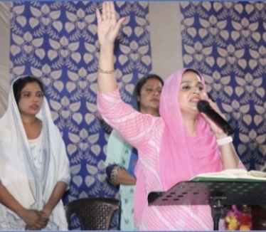 Pastor Shakuntla (Gulli) speaking at a Christian gathering
